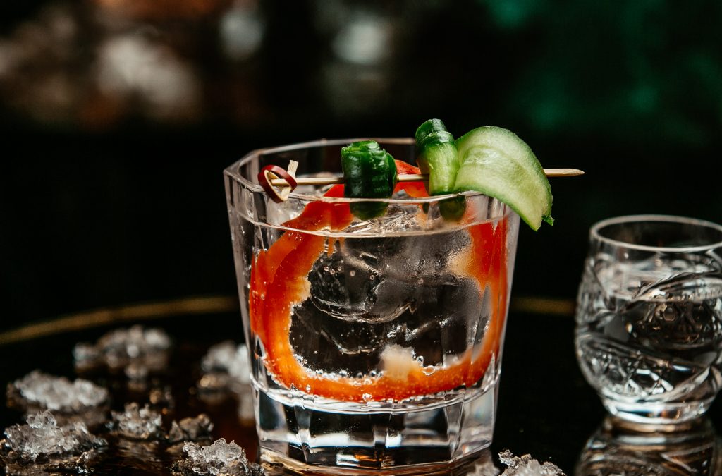 vodka-glass-with-oliv-cucumber-red-pepper-slice